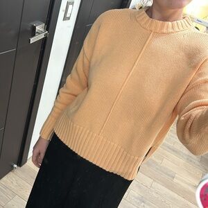 Pastel Orange sweater. Size Medium.